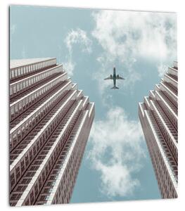 Obraz letadla mezi budovami (30x30 cm)