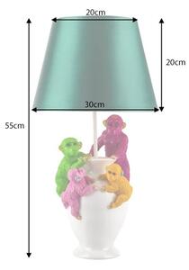 Designová stolní lampa Tierra Glam se zeleným textilním stínítkem a bílou podstavou s barevnými figurami opic 55 cm