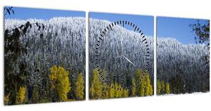 Obraz - zasněžené hory v zimě (s hodinami) (90x30 cm)