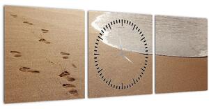 Obraz - stopy v písku a moře (s hodinami) (90x30 cm)