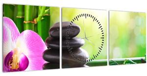 Obraz masážních kamenů a orchidee na vodě (s hodinami) (90x30 cm)