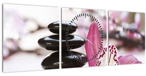 Obraz masážních kamenů a orchidee (s hodinami) (90x30 cm)