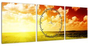 Obraz louky se zářícím sluncem (s hodinami) (90x30 cm)