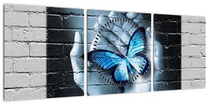 Obraz modrého motýla na zdi (s hodinami) (90x30 cm)