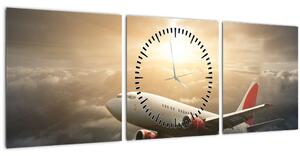 Obraz - Letadlo v oblacích (s hodinami) (90x30 cm)