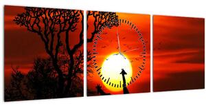 Obraz - Siluety zvířat při západu slunce (s hodinami) (90x30 cm)