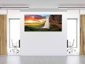 Obraz skleněný vodopád v horách a západ slunce - 30 x 60 cm