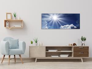Obraz skleněný slunce na modrém nebi - 30 x 60 cm