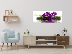 Obraz skleněný temný květ orchideje na kameni a hladině - 30 x 60 cm