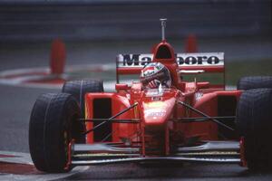 Fotografie Michael Schumacher in a Ferrari F310B at the Belgian GP, Spa Francorchamps, Belgium, 1997, (40 x 26.7 cm)