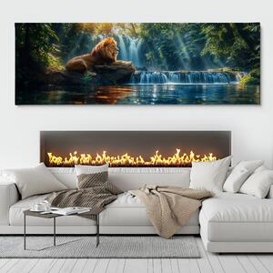 Obraz na plátně - Lev odpočívá u vodopádu v džungli FeelHappy.cz Velikost obrazu: 90 x 30 cm
