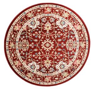 Červený kulatý koberec ve vintage stylu