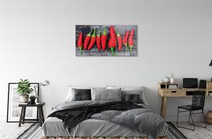 Obraz na skle červené papriky 100x50 cm