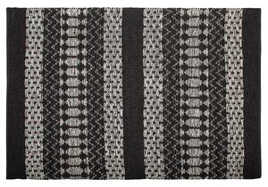 Kožený koberec 140 x 200 cm černý/béžový SOKUN
