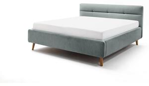 Modrá čalouněná dvoulůžková postel s úložným prostorem a s roštem 180x200 cm Lotte – Meise Möbel