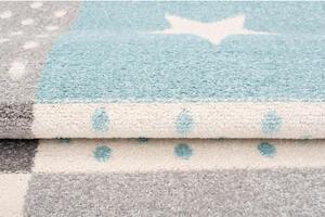 Bílo-tyrkysový koberec se vzory