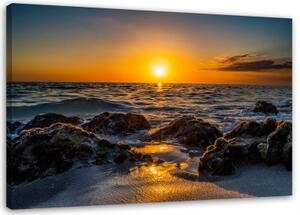 Obraz na plátně Západ slunce na kamenité pláži - 100x70 cm