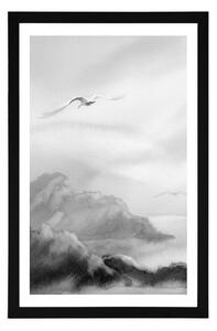Plakát s paspartou přelet ptáků přes krajinku v černobílém provedení