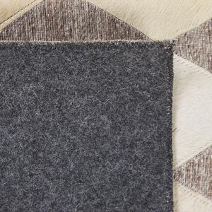 Kožený koberec béžovo-hnědý 140 x 200 cm SESLICE