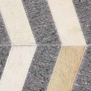 Kožený koberec v šedé a béžové barvě 160 x 230 cm BAGGOZE