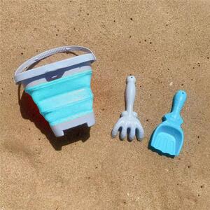 Skládací kyblík na písek s lopatkou a hráběmi Woopie modrý