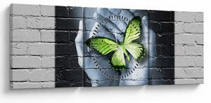 Obraz - Zelený motýl ve zdi (s hodinami) (90x30 cm)