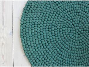 Fran has a woolen round. Menagerie Cream Forest Rug. Green Round.