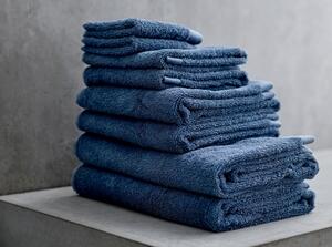 Modrý ručník z froté bavlny Södahl Indigo, 100 x 50 cm