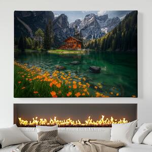 Obraz na plátně - Rozkvetlá louka u jezera s chatou FeelHappy.cz Velikost obrazu: 150 x 100 cm