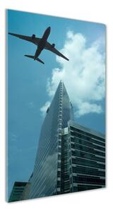 Vertikální Fotoobraz na skle Letadlo nad městem osv-83969980