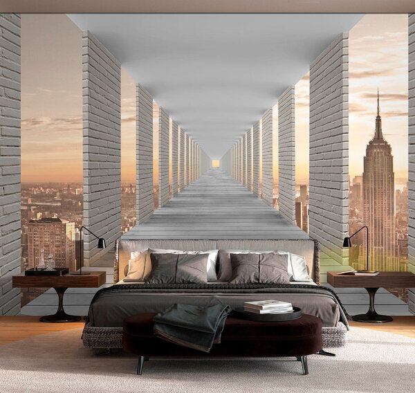 Fototapeta Dlouhý chodník se sloupy a městem v pozadí, Fototapeta s panoramatem města, Populární fototapety, u59788 - Tapeko.co.cz