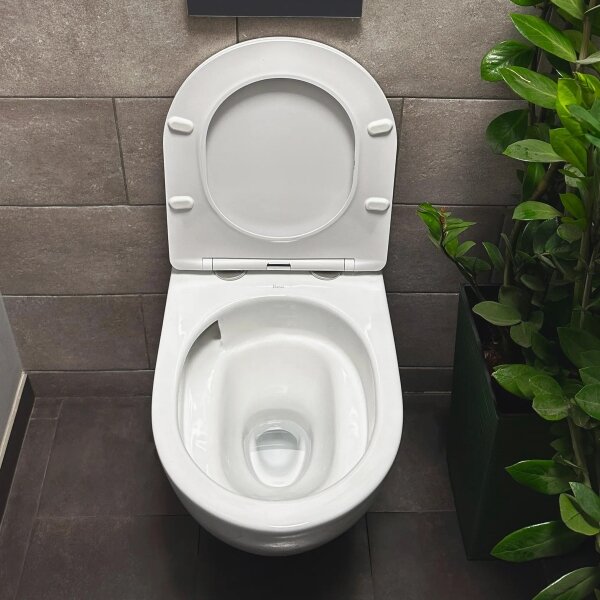 REA-C1259 - Závěsné WC s prkénkem CARLO MINI TORNADO RIMLESS keramika/lesk. bílá