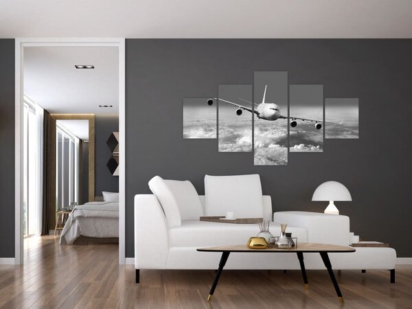 Obraz - Letadlo v oblacích, černobílé (125x70 cm)
