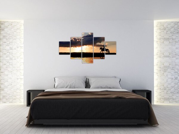 Obraz - Jezdec na koni při západu slunce (125x70 cm)