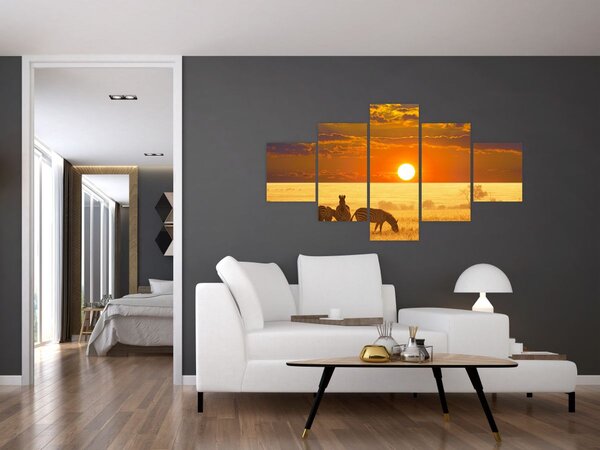 Obraz - Zebry se západem slunce (125x70 cm)