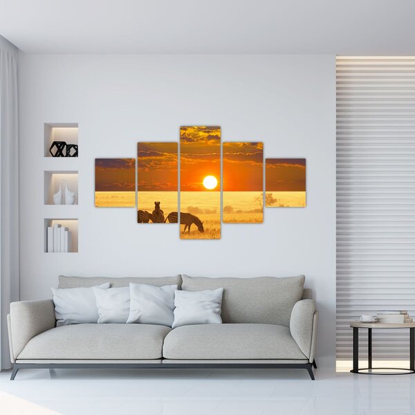 Obraz - Zebry se západem slunce (125x70 cm)