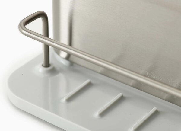 Joseph Joseph Stříbrno-bílý nerezový stojan na mycí prostředky Surface Sink Tidy