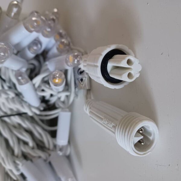 DECOLED Eco fix LED světelný řetěz 10 m, 60 zářivějších diod, teple bílá, 36V, bílý kabel, IP44
