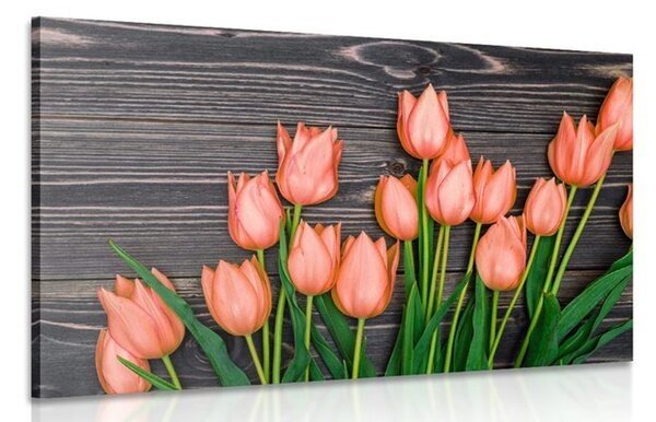 Obraz očarující oranžové tulipány na dřevěném podklade