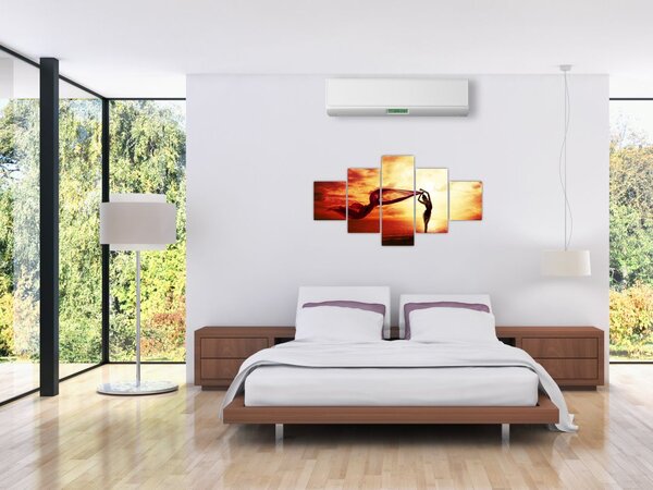 Obraz - Silueta ženy v západu slunce (125x70 cm)