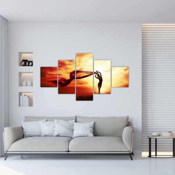 Obraz - Silueta ženy v západu slunce (125x70 cm)