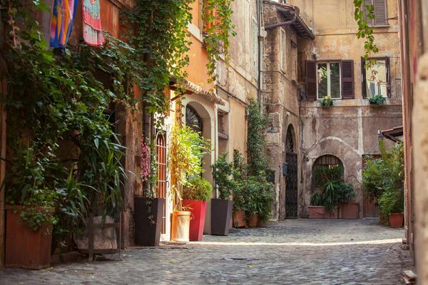 DIMEX | Vliesová fototapeta Ulice v Římě MS-5-0716 | 375 x 250 cm| zelená, oranžová, šedá