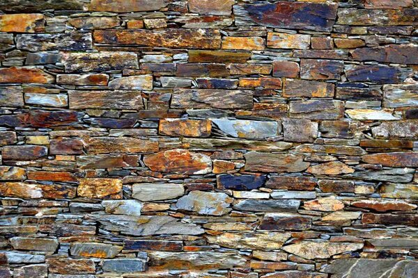 DIMEX | Vliesová fototapeta Stará tradiční kamenná zeď MS-5-2444 | 375 x 250 cm | modrá, hnědá, šedá