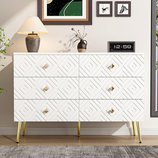 Moderní komoda se šesti zásuvkami, rozměry 120x40x80 cm, v elegantní bílé barvě s zlatými detaily