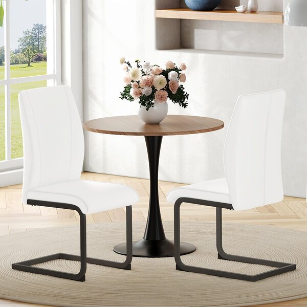 Dvoudílná sada jídelních židlí z umělé kůže s černými kovovými nohami a ergonomickým designem