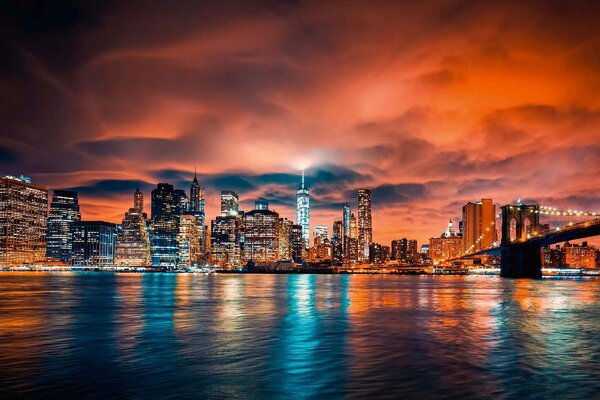 DIMEX | Vliesová fototapeta NYC př západ slunce MS-5-3010 | 375 x 250 cm | modrá, bílá, černá, oranžová