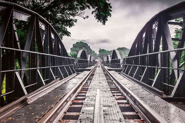 DIMEX | Vliesová fototapeta Kovový most River Kwai MS-5-2864 | 375 x 250 cm | zelená, černá, šedá
