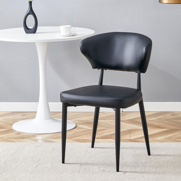 Černá minimalistická ergonomická jídelní židle s prohnutým opěradlem, komfortní design, nabízí zážitek z posezení plný pohodlí a jednoduchosti. Balení obsahuje 2 židle. Černá barva