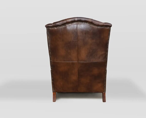 Chesterfield Harold Kožené křeslo na vysokých nohách puncované tmavě hnědé