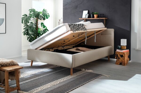 Béžová čalouněná dvoulůžková postel s úložným prostorem s roštem 140x200 cm Lotte – Meise Möbel